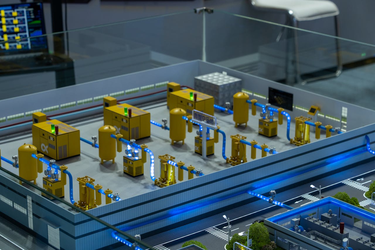 experience-img Detailed industrial model display showcasing machinery and systems indoors, emphasizing technology and design.