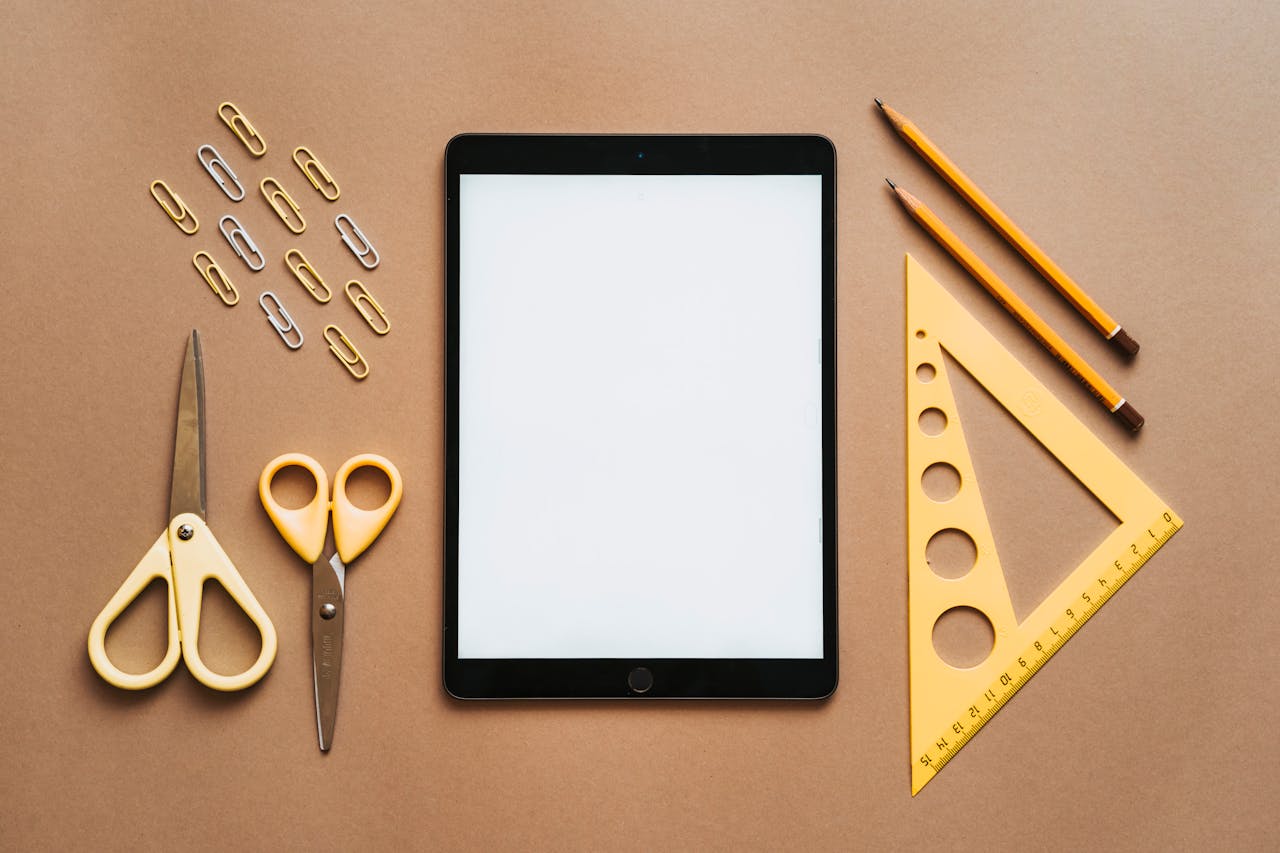 services-02 Stationery arranged with tablet on brown background.